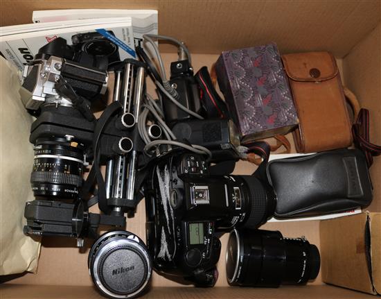 A Nikon F90x, a Nikkormat camera, various Vintar lenses and accessories, and a Nikon AF Micro Nikkor F2.8 105mm lens